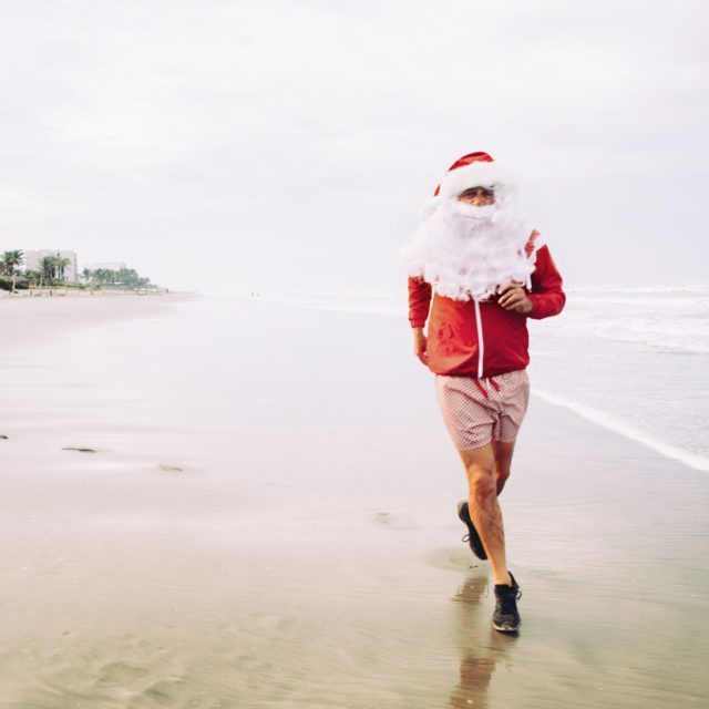 Santa Claus Jogging on beach